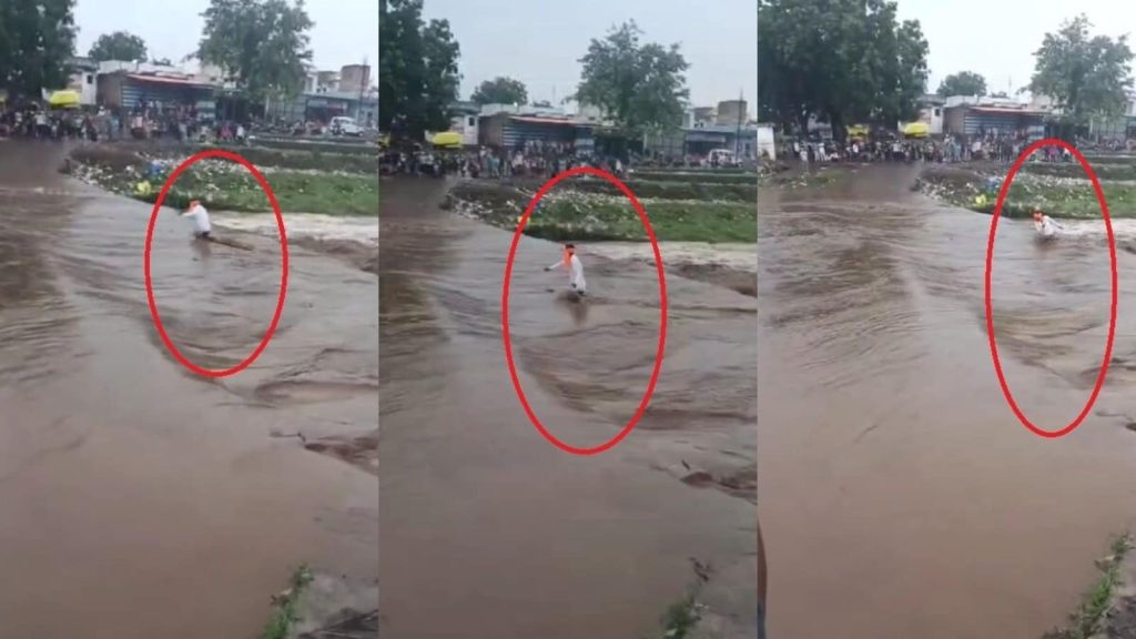 મધ્યપ્રદેશના ખારગોન જિલ્લાના ઝિર્યાના વિસ્તારમાં ઉગતી નદીની સામે એક … मध्य प्रदेश के खरगोन जिले के झिरन्या क्षेत्र में उफनती नदी के सामने एक...