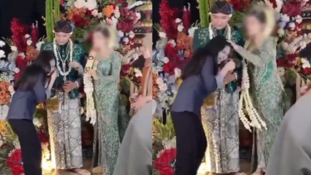 दूल्हे का महिला ने चूमा हाथ तो दुल्हन ने खोया आपा, कंधा पकड़कर नोंचे बाल; Video में देखें पूरा बवाल | video woman kissed grooms hand angry bride push her back pull...